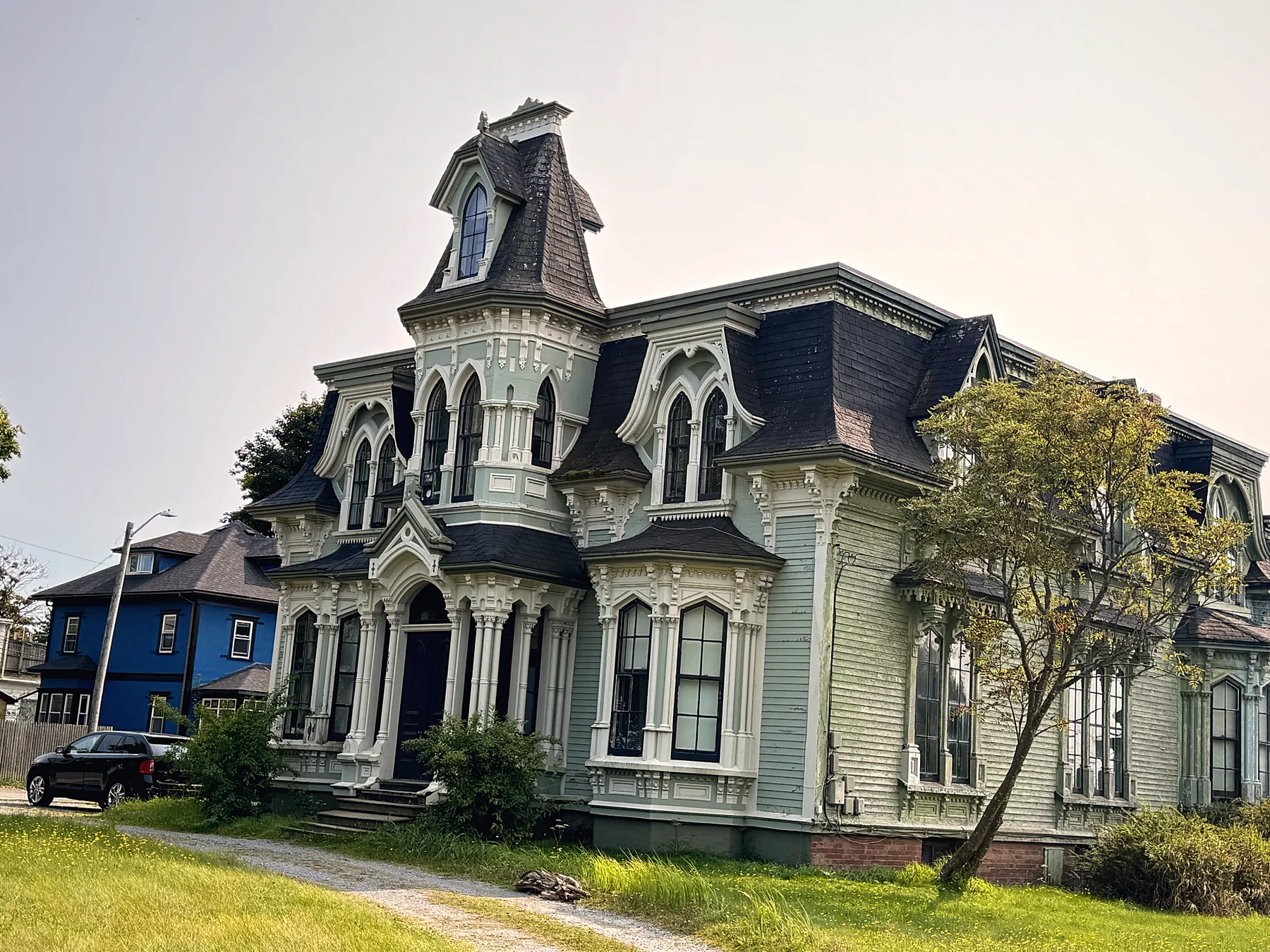 Grand Victorian house with a mansard roof and ornate trim