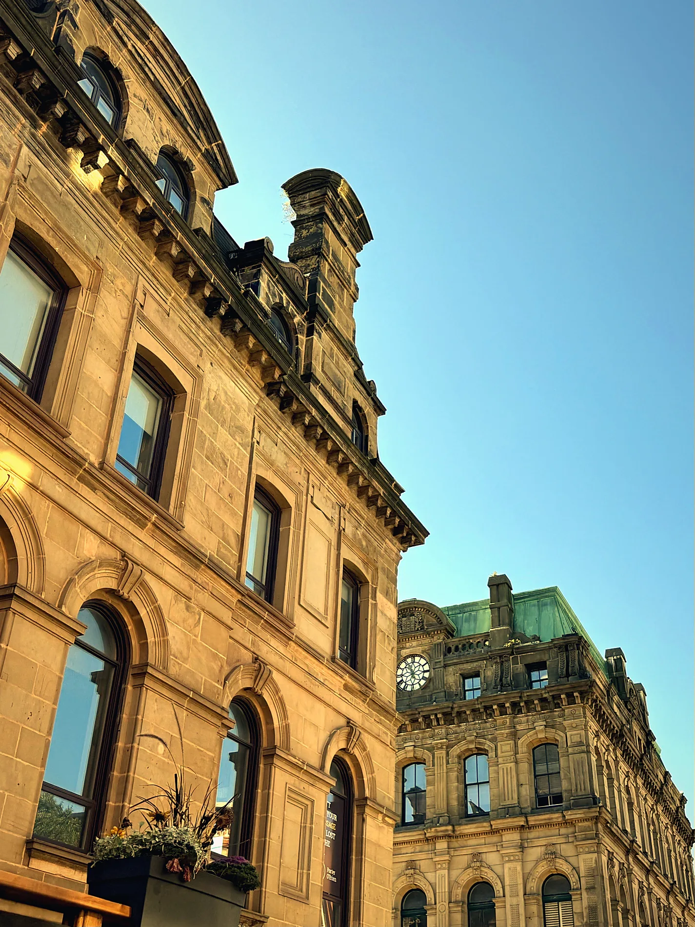 Sandstone heritage buildings against a blue sky